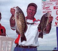 Mr. Wil Wegman holding two bass at the Northern B.A.S.S. Qualifier at Lake St. Clair.