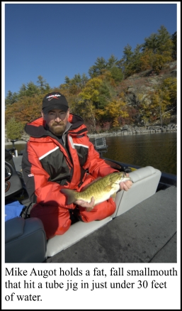 Mike Augot holds a fat, fall smallmouth